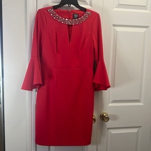 Bright pink dress for party or event. Bell sleeves. Rhinestone decal.